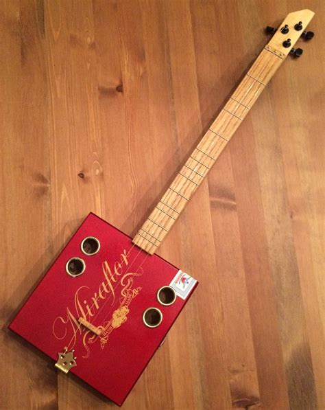 acoustic vs electric cigar box guitar|cigar box electric strings.